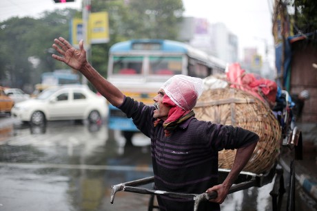 Indian Rickshaw Puller Protects Himself Cold Editorial Stock Photo