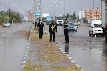 COUNT Palestinian Police Regulate Traffic During A Rainy Day Dair