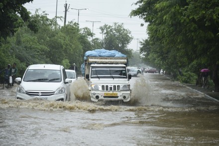 Vehicles Wade Through Waterlogged Road Due Editorial Stock Photo