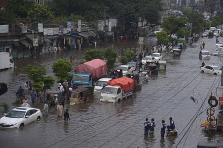 Pakistani Commuters Wade Through Flooded Road Editorial Stock Photo