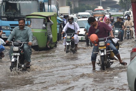 Pakistani People Wade Through Flooded Road Editorial Stock Photo