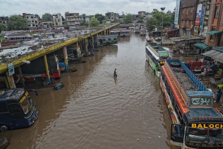 Pakistani People Wade Through Flooded Road Editorial Stock Photo