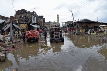 Pakistani People Wade Through Flooded Road Editorial Stock Photo