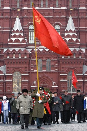 Communists March Red Flag During Flowerlaying Editorial Stock Photo