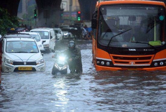 Commuters Wade Through Waterlogged Stretch Near Editorial Stock Photo