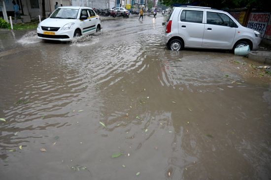 Commuters Pass Through Heavily Waterlogged Stretch Editorial Stock