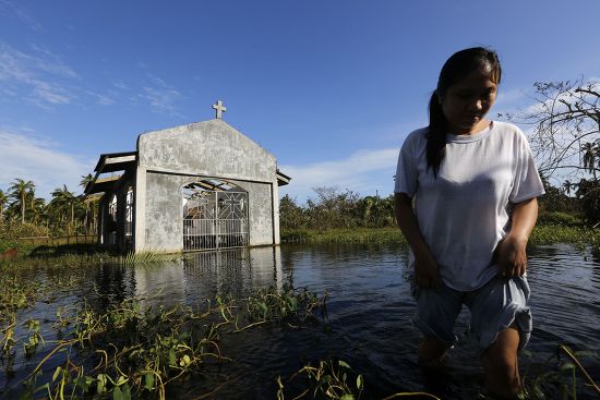 Filipino Typhoon Victim Wades Thru Floodwater Editorial Stock Photo