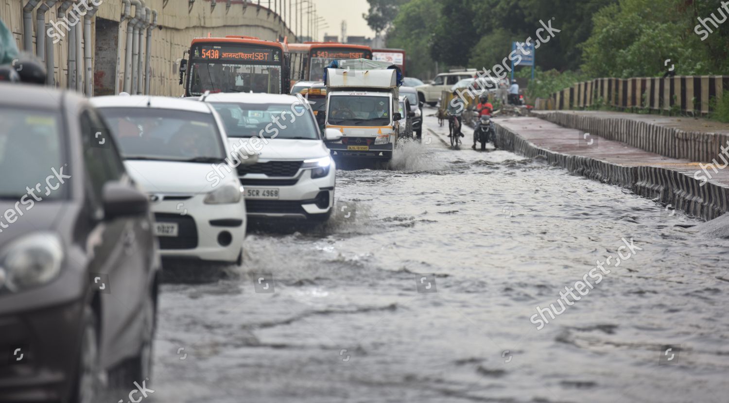 Commuters Wade Through Waterlogged Road After Editorial Stock Photo