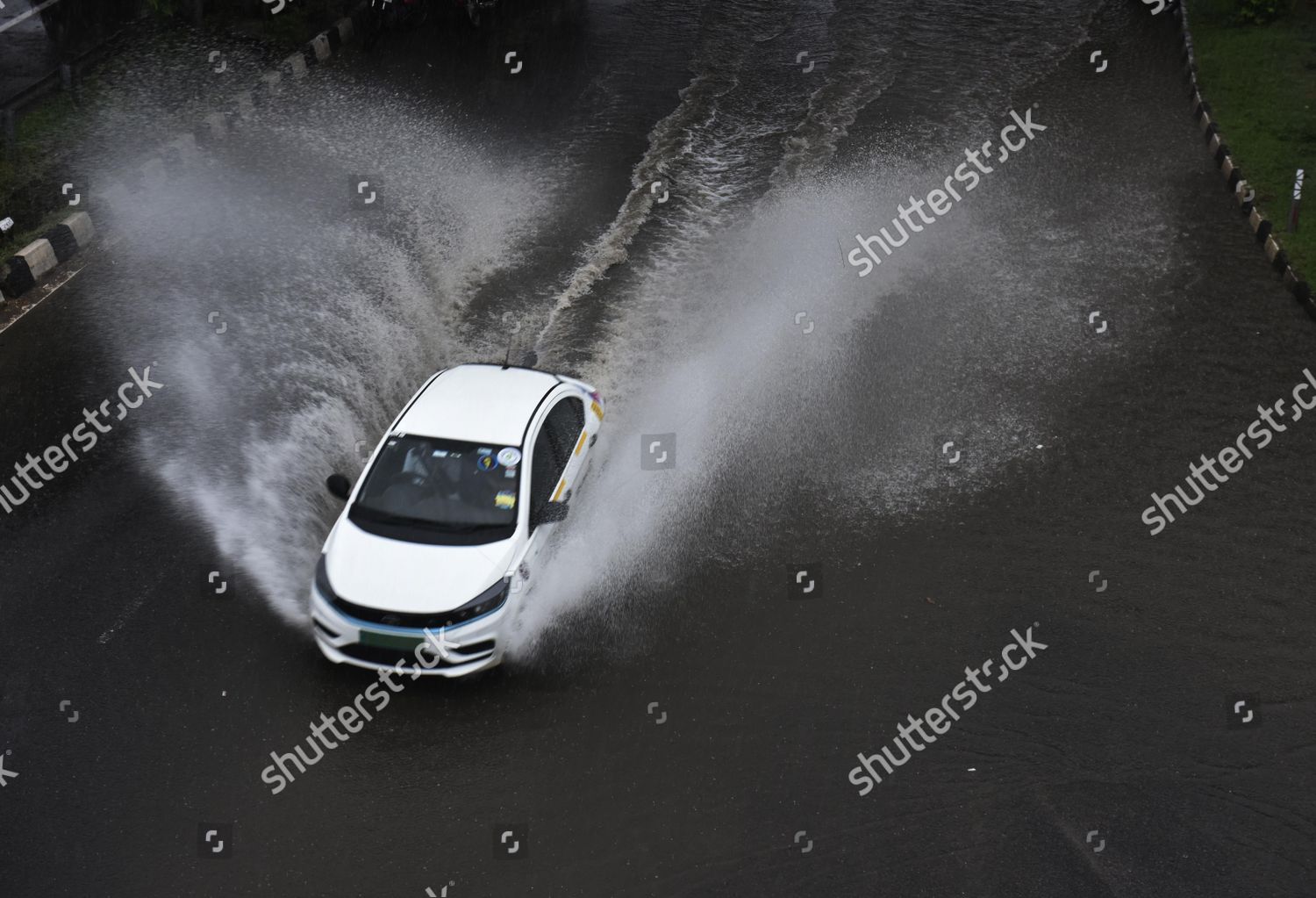 Vehicle Wades Through Waterlogged Stretch On Editorial Stock Photo