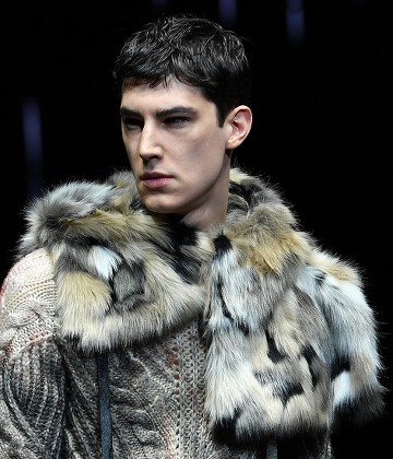 MILAN - JANUARY 15: Man with blue fur coat and Faure Le Page bag looking at  smartphone before Giorgio Armani fashion show, Milan Fashion Week street s  Stock Photo - Alamy