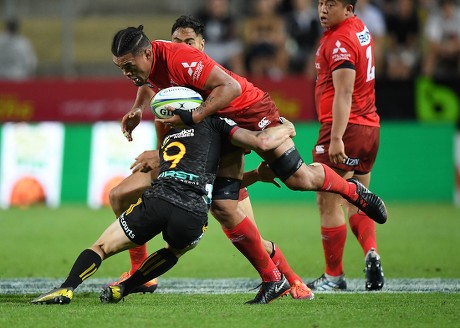Sunwolves Hendrik Tui is wrapped up in the tackle by Chiefs Brad Weber during the Super Rugby match between Chiefs and Sunwolves in Hamilton, New Zealand, 02 March 2019.
