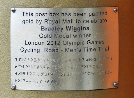 Gold Royal Mail Postbox In Disgraced Cyclist Bradley Wiggins Home Town Of Eccleston Lancs. Which Was Painted Gold In Honour Of His Olympic Gold Medal Win.