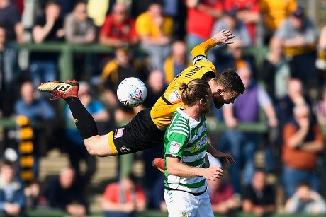 Mark O'Brien of Newport County wins a header from Alex Fisher of Yeovil Town  during Yeovil Town vs Newport County, Sky Bet EFL League 2 Football at Huish Park on 30th March 2019