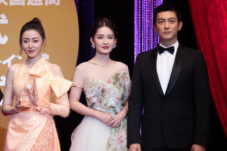 Zhang Tianai, Li Qin and Du Jiang poses after receiving their Gold Crane Award at the China Film Week Closing Ceremony during the Tokyo Film Festival