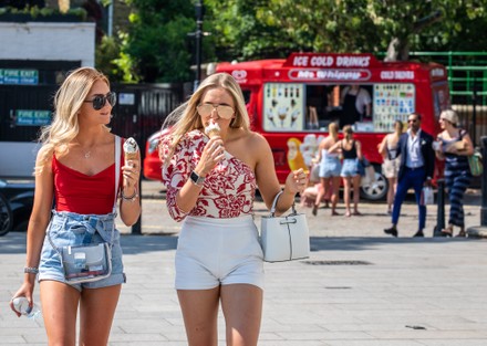 Warm weather sees members of the public go out to enjoy the sunshine and warm weather as the 2 metre rules is reduced to 1, London, UK - 23 Jun 2020