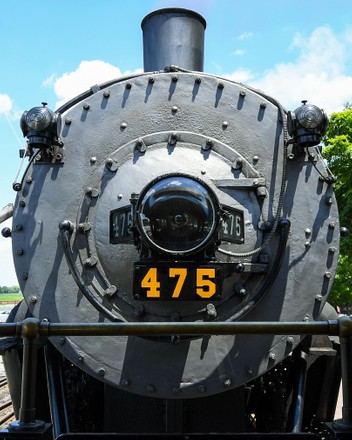 The Strasburg Railroad, Norfolk & Western, 475 steam locomotive passes an  American Flag during its return to the station on Monday, June, 29, 2020,  in Ronks, Pennsylvania. The Strasburg Railroad re-opened for