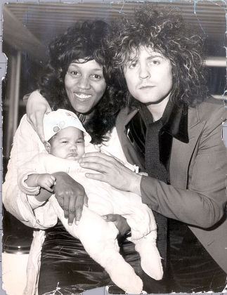 Singer Marc Bolan Pictured With His Girlfriend Gloria Jones And Their Son Rolan At Heathrow Airport.