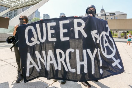 Masked Protesters Holding Banner Saying Queer Editorial Stock Photo