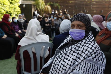 Palestinian mourners, clad in protective masks against the COVID-19 coronavirus pandameic, attend the funeral of the Palestinian Authority's chief negotiator Saeb Erekat, Jericho, West Bank, Palestinian Territory - 11 Nov 2020