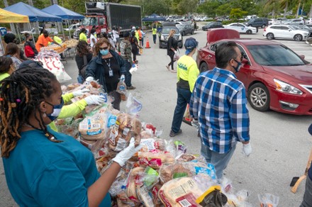 Volunteers deliver Thanksgiving meal distribution  in front of Miami City Hall, USA - 20 Nov 2020
