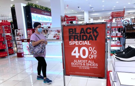 Shopper Wearing Face Mask Walks Past Editorial Stock Photo - Stock