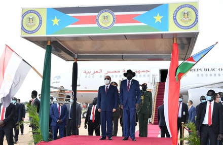 Egypt's President Abdel Fattah al-Sisi and South Sudan's President Salva Kiir, wearing protective face masks, stand as they listen to national anthems, Juba, Sudan - 28 Nov 2020