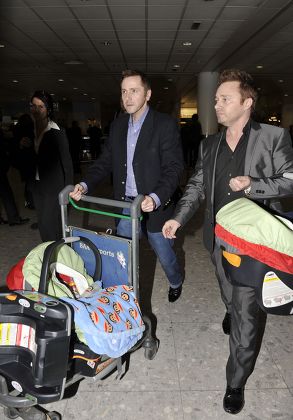 Britains first gay surrogate fathers, Barrie and Tony Drewitt-Barlow at Heathrow Airport, London, Britain  - 01 Mar 2010