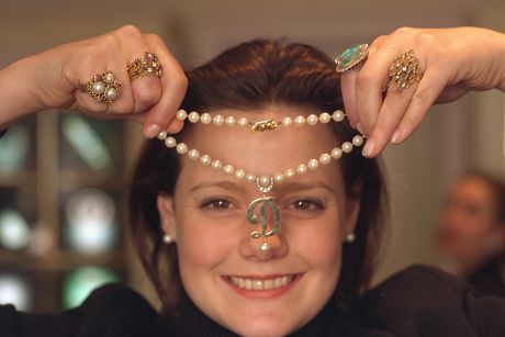All Pictures Show Emma Blaydon Of Sothebys In London Posing With Items Of Jewellery Owned By The Former Wife Of Actor Roger Moore Dorothy Squires. Thirteen Items Went For Auction The Items Seen In In This Picture Left To Right Are Priceda Ring Sold F
