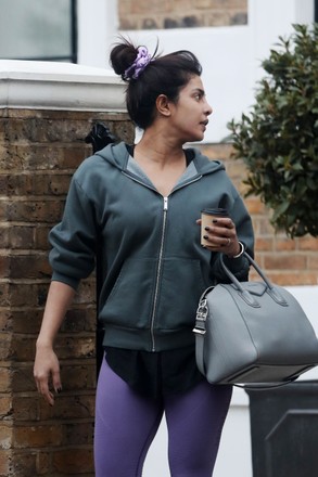 priyanka chopra sports a hooded jacket and purple leggings as she leaves  her home in london, uk-190221_10