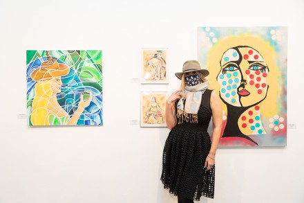 Artist Tatiana Lisovskaya poses with her work. One Art Space in Tribeca held an opening reception for their 5th Annual International Women's Day Art Fair. The exhibition features a diverse, international collection of talent, female-identifying artists of varying ages.