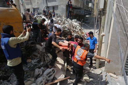 Palestinian Rescuers Pull Survivor Under Rubble Editorial Stock Photo ...