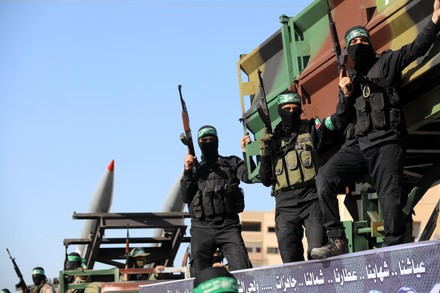 Members of the Izz-Al Din Al-Qassam Brigades, the armed wing of the Hamas movement, parade in an anti-Israel rally in Khan Younis, Khan Younis, Gaza Strip, Palestinian Territory - 27 May 2021