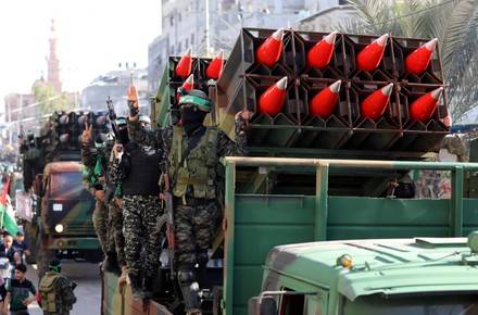 Members of the Izz-Al Din Al-Qassam Brigades, the armed wing of the Hamas movement, parade in an anti-Israel rally in Khan Younis, Khan Younis, Gaza Strip, Palestinian Territory - 27 May 2021