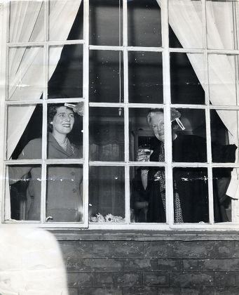 Baroness Spencer Churchill Seen Here At The Window Raising A Toast To Winston Churchill's 86th Birthday With Her Daughter Mary Soames.