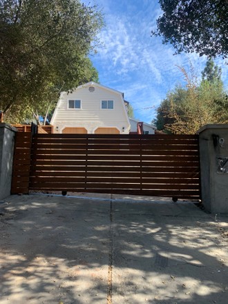 Patrisse Cullors erects fence around her home in Topanga Canyon, California, USA - Jun 2021