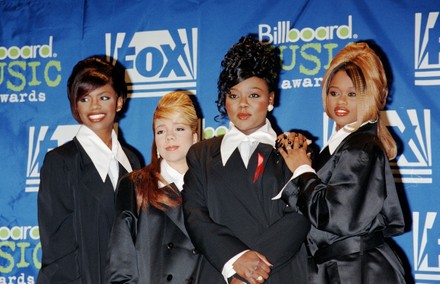 Kandi Burruss, Tameka Cottle, LaTocha Scott, and Tamika Scott of R&B group Xscape stands at the 1995 Billboard Music Awards December 6, 1995 in New York City.