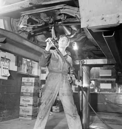 Teenage Garage Attendant Working Under Car Editorial Stock Photo ...