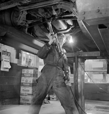 Teenage Garage Attendant Working Under Car Editorial Stock Photo ...