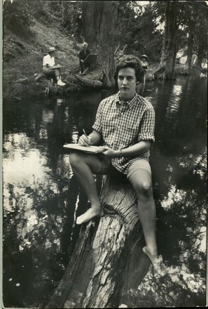 Summer Culture- Solemn artist, Carolyn Bennett, sketches on a cypress stump beside river at Hill Country Arts Foundation at Ingram, Texas. New this year, Hill Country also teaches theater and has classes in weaving mohair, a local product, Idyllwild, Calif