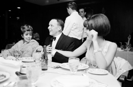 Frank Sinatra at dinner seated next to his 16 year old daughter, Christina, wearing pearls., Las Vegas, Nevada, USA