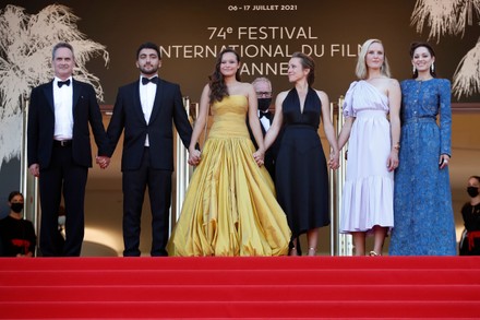 Denis Carot, Mohamad Aljounde, Melati Wijsen, Flore Vasseur, Mary Finn and Marion Cotillard arrive for the screening of 'De Son Vivant' (Peaceful) during the 74th annual Cannes Film Festival, in Cannes, France, 10 July 2021. The movie is presented Out of Competition at the festival which runs from 06 to 17 July.
