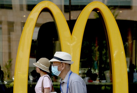 Chinese Walk Past a McDonald's in Beijing, China - 21 Jul 2021