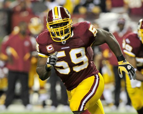 LeBron James tosses the football before the beginning of the game as the Dallas  Cowboys faced the Washington Redskins at FedEx Field in Landover, Maryland,  Sunday, September 12, 2010. (Photo by Ron