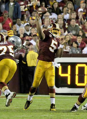 LeBron James tosses the football before the beginning of the game as the Dallas  Cowboys faced the Washington Redskins at FedEx Field in Landover, Maryland,  Sunday, September 12, 2010. (Photo by Ron