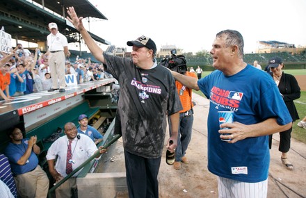 Chicago Cubs' Alfonso Soriano sprays the fans in the bleachers with  champagne as he celebrates after the Cubs beat the St. Louis Cardinals 5-4  to clinch the N.L. Central Division at Wrigley