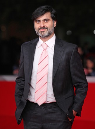 Hossein Keshavarz arrives on the red carpet before a screening of the film "Dog Sweat" during the 5th Rome International Film Festival in Rome on October 29, 2010.