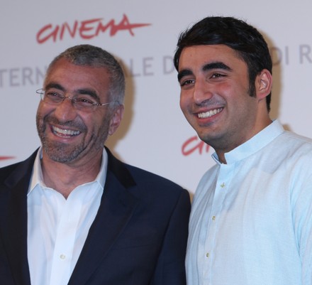 Duane Baughman (L) and Bilawal Bhutto Zardari arrive at a photocall for the film "Bhutto" during the 5th Rome International Film Festival in Rome on October 30, 2010.