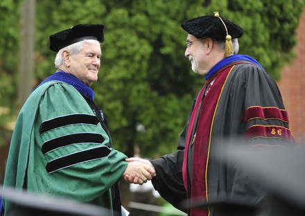 Gingrich shakes hands with Arnold at Eureka College, Illinois, United States - 14 May 2011