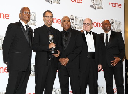 Producers of Real Husbands of Hollywood Ralph Farquhar, Jesse Collins, Stan Lathan, Tim Gibbons, and Chris Spencer hold the award they won for Outstanding Comedy Series for "Real Husbands of Hollywood" backstage at the 45th NAACP Image Awards at the Pasadena Civic Auditorium in Pasadena, California on February 22, 2014. The NAACP Image Awards celebrates the accomplishments of people of color in the fields of television, music, literature and film and also honors individuals or groups who promote social justice through creative endeavors.