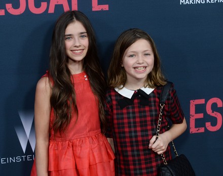 Cast members Sterling Jerins (L) and Claire Geare attend the premiere of the motion picture thriller "No Escape" at Regal Cinemas LA Live in Los Angeles on August 17, 2015. Storyline: In their new overseas home, an American family soon finds themselves caught in the middle of a coup, and they frantically look for a safe escape in an environment where foreigners are being immediately executed.